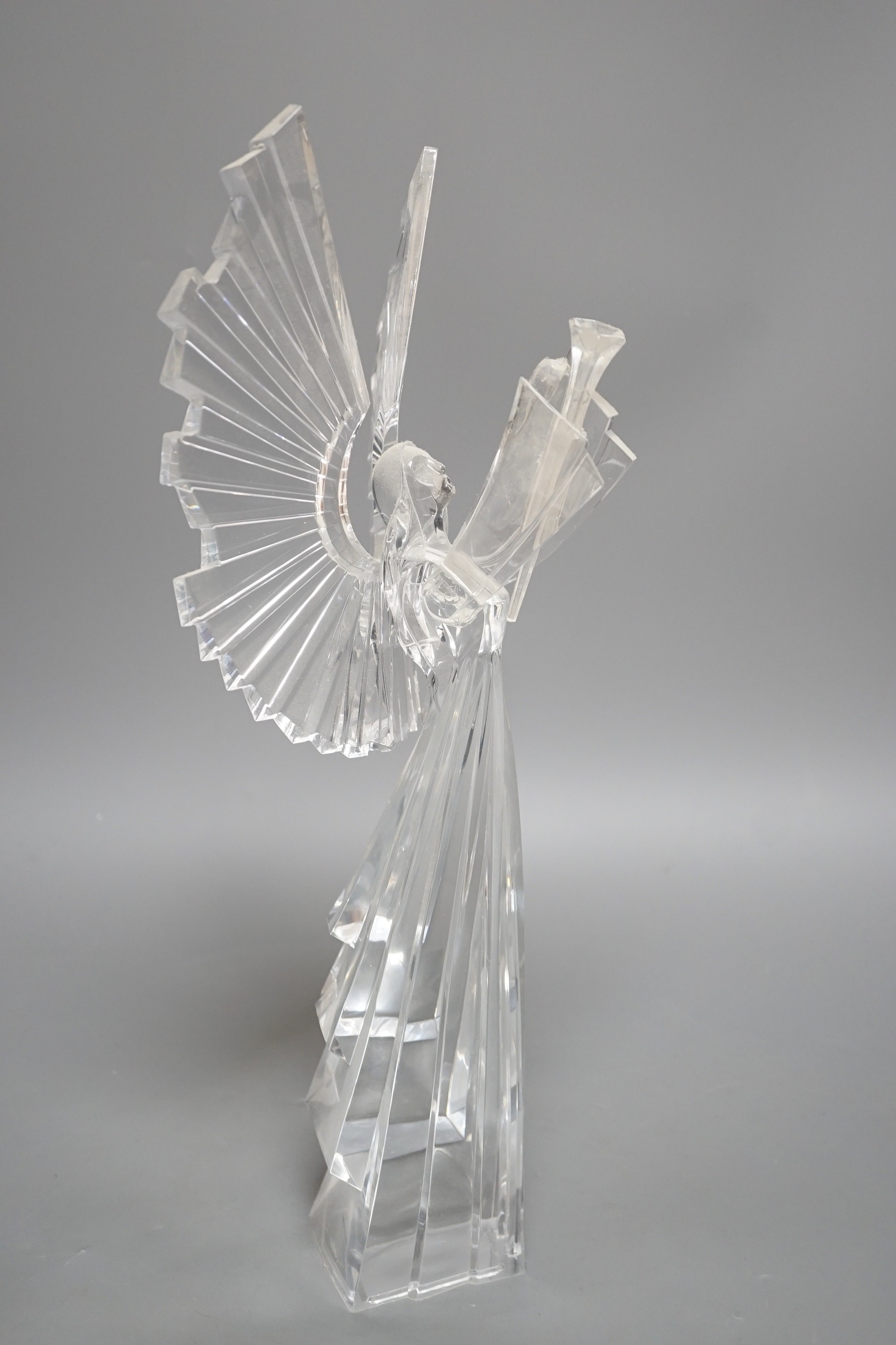 A set of six clear resin trumpeting arch-angels. 40cm tall.